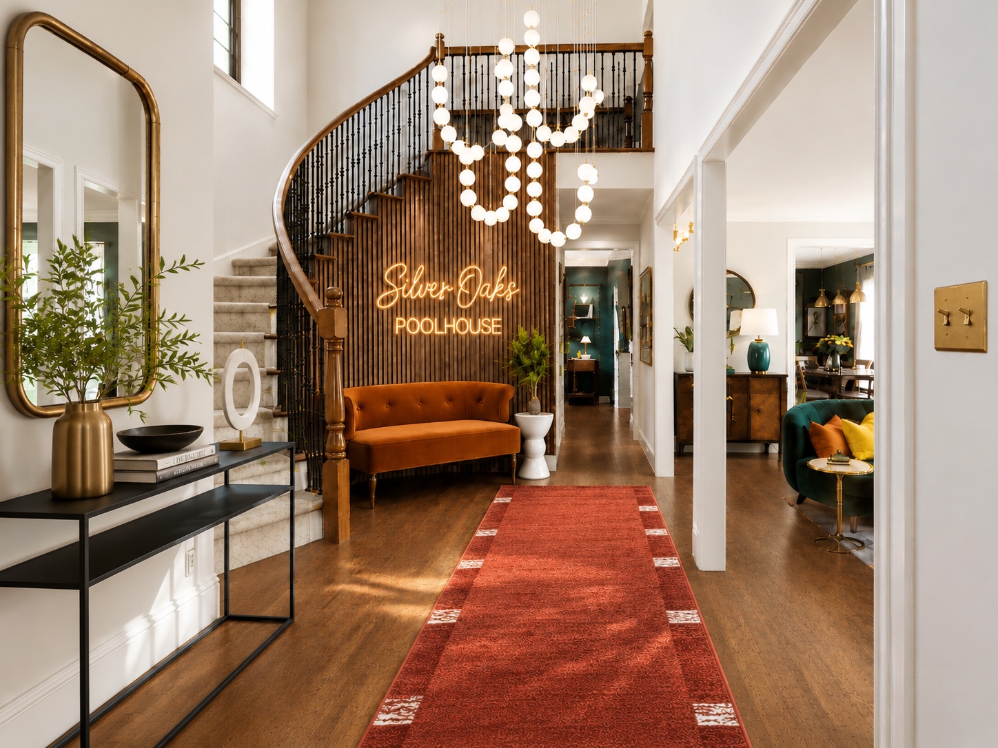Silver Oaks Retreat foyer with sculptural lighting and curved staircase